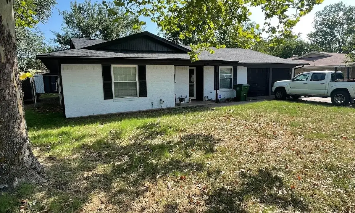 Professional roofing crew working on a residential roof in London